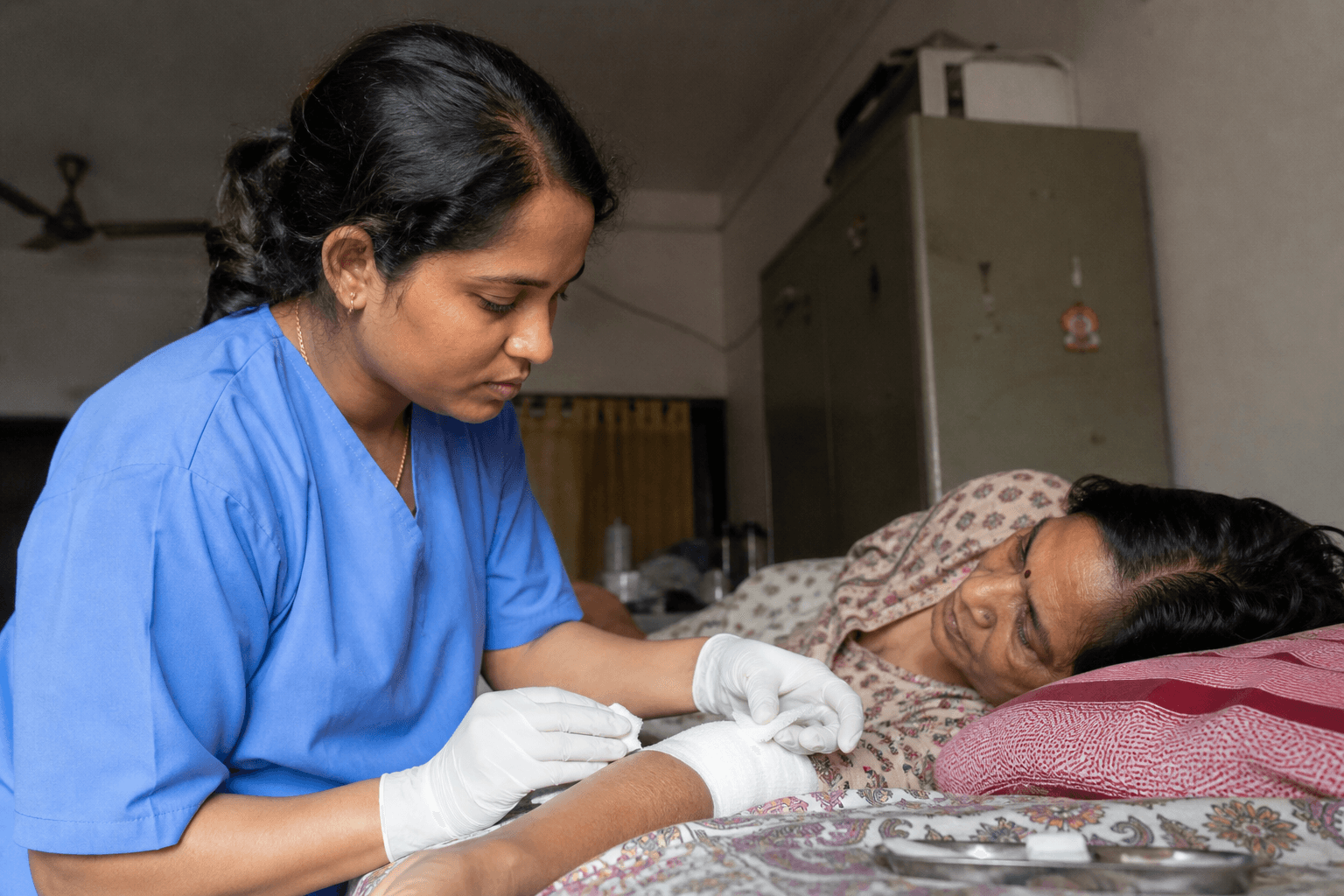 Indian nurse supporting post-surgery recovery care at home